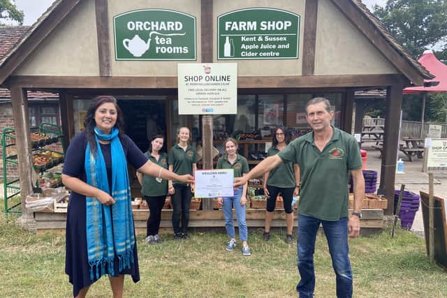 MP Nus Ghani with John Smith, owner of Perryhill Orchards, and his team