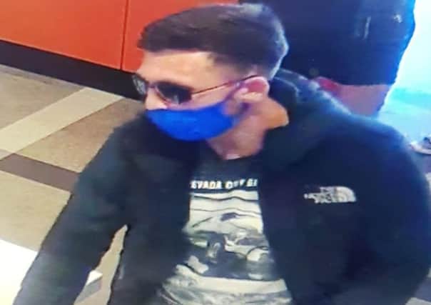 Police want to speak to this man after a robbery in a Brighton Burger King