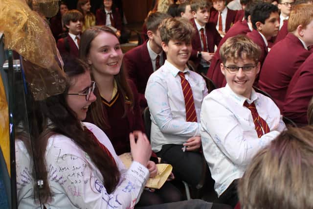 Students taking in their last assembly