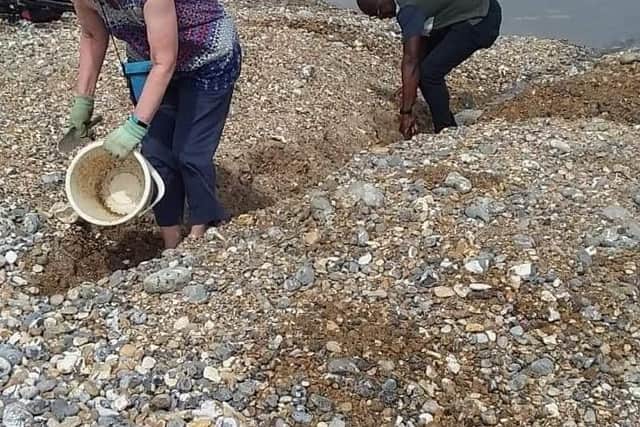 Residents took up the task of moving shingles from the mouth of the River Cuckmere