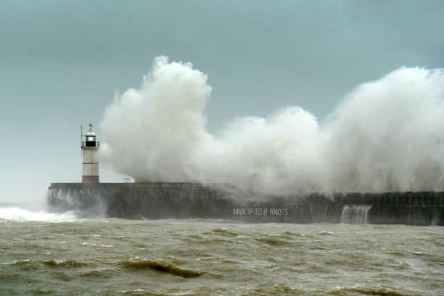 Large waves and sea spray are expected (photo of Newhaven Lighthouse taken previously by Peter Cripps)