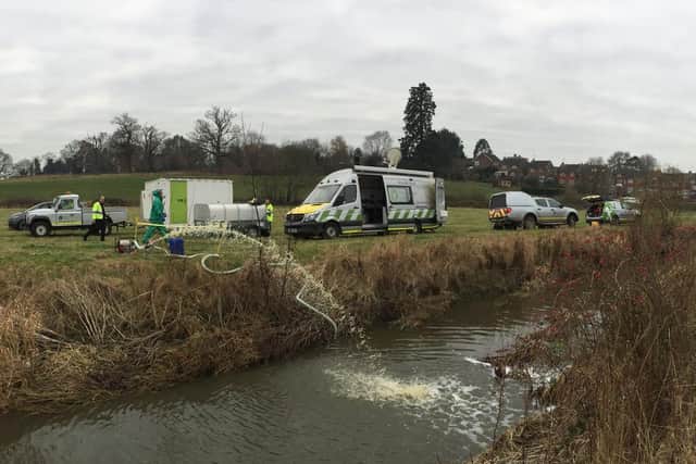 Environment Agency officers increase the oxygen in the stream. Picture: Environment Agency