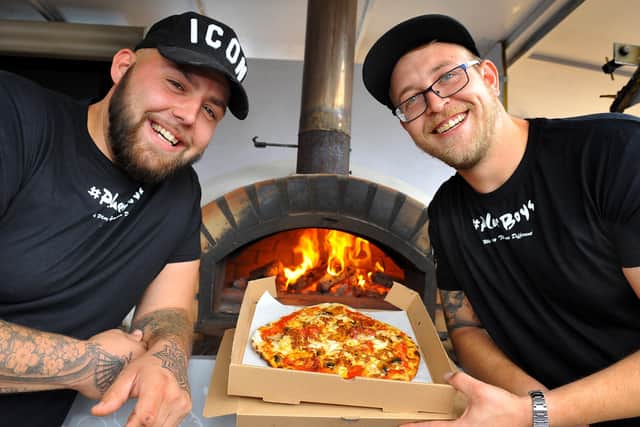 Best friends Elliott Barber and Toby Poole (wearing glasses) have set up a successful pizza business. Pic Steve Robards SR2008272 SUS-200827-173318001