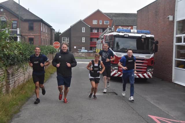 Littlehampton Blue Watch firefighters cross the finish line