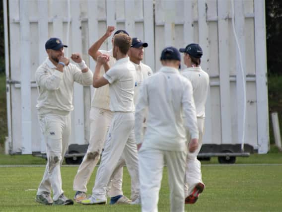 Eastbourne celebrate a wicket against Hastings Priory on Saturday. Picture by Andy Hodder