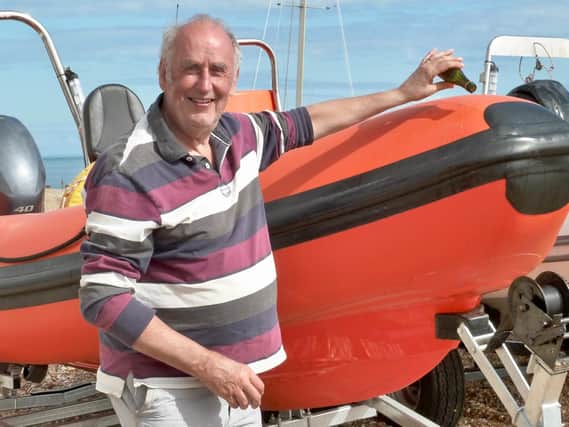 Dave Gordon names the new power boat, Gordon.