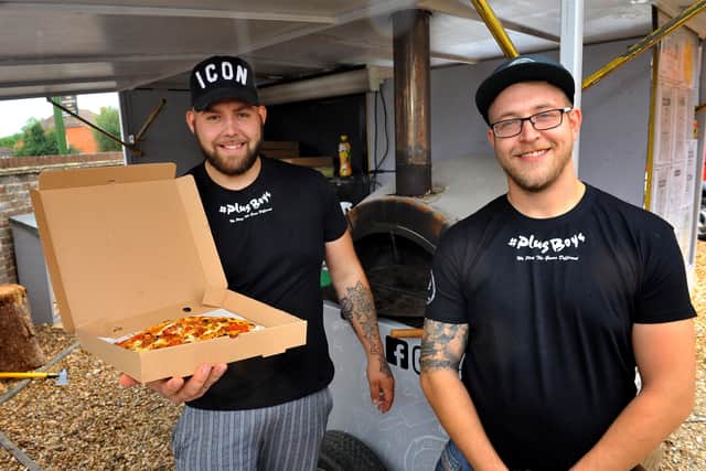 Best friends Elliott Barber and Toby Poole (wearing glasses) have set up a successful pizza business. Pic Steve Robards