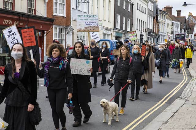 Activists carried decorated umbrellas through Lewes