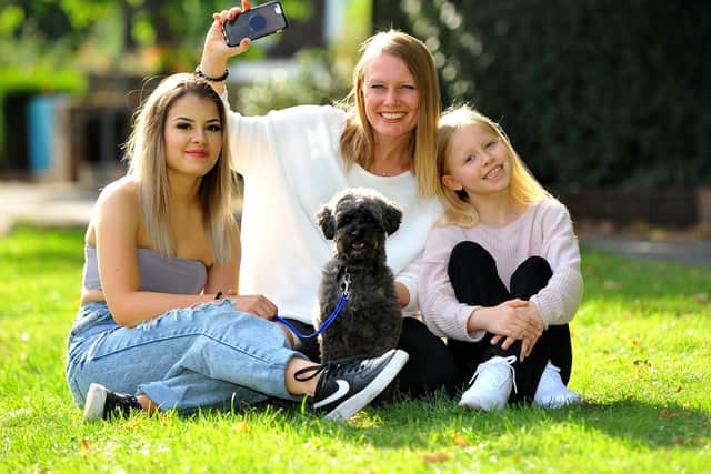 Tiktok stars Jo Gill and daughters Jade (left)  and Summer (right) with their dog Bobby. Pic Steve Robards SR20090075 SUS-200709-173952001