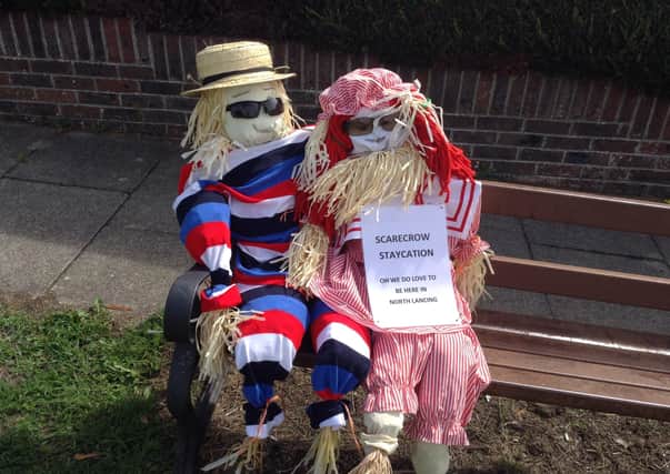 Scarecrow couple enjoying a staycation
