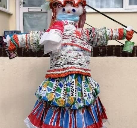 Recycled bread bags make up this scarecrow's unique skirt