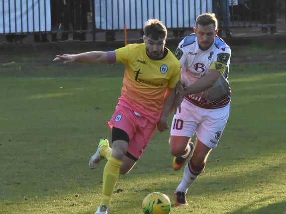 Lloyd Cotton in action for Haywards Heath Town against Hastings United last season. Picture by Grahame Lehkyj