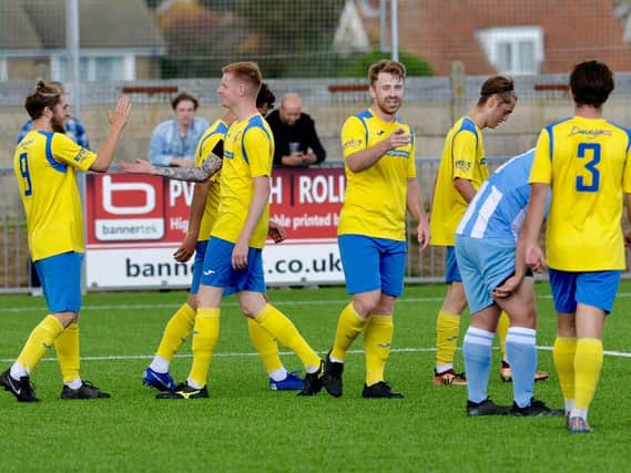 Lancing celebrate one of the goals in their opening day win over Lingfield / Picture Stephen Goodger