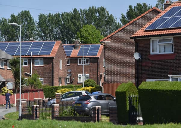 Homes with solar panels on their roofs.(Photo by Anthony Devlin/Getty Images) SUS-200914-125634001