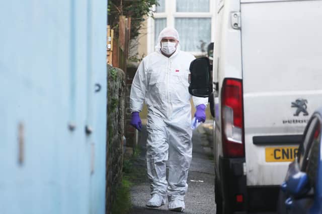 A forensic at the scene in Newhaven in January