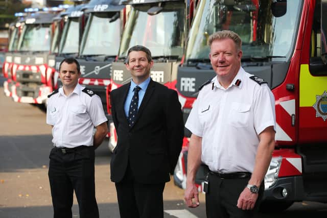 Cabinet member Duncan Crow with senior fire officers in front of the new apppliances for West Sussex Fire and Rescue Service