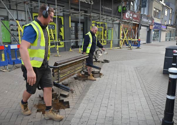Benches being removed from Wellington Place in Hastings.