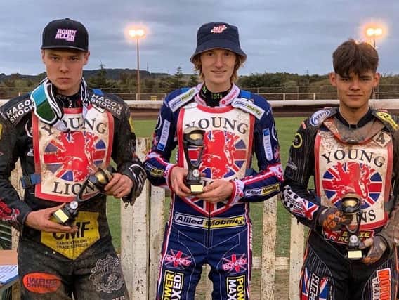 Drew Kemp, centre, with his trophy at the British U19 speedway final / Picture: Taylor Lanning Photography