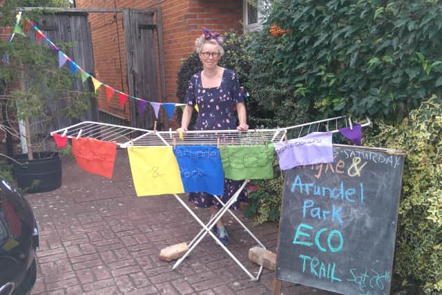 Chichester South councillor Sarah Sharp with her handmade logo for the Whyke and Arundel Park Eco Weekends