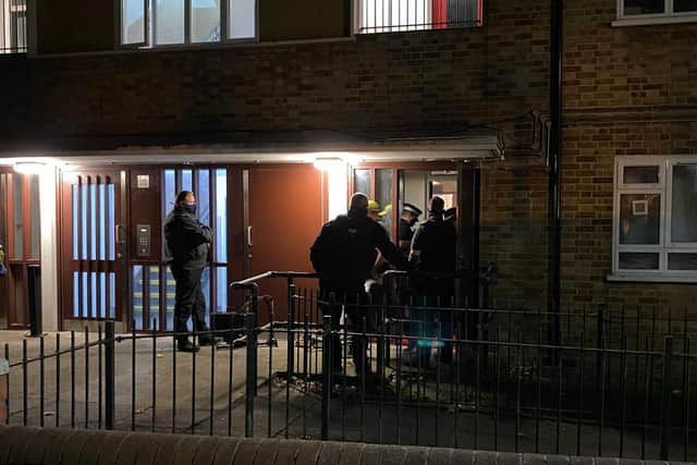 Police raid a flat in South London where a West Sussex man was arrested