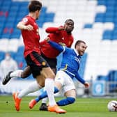 Brighton's Aaron Connolly collides in the box with Manchester United's Paul Pogba