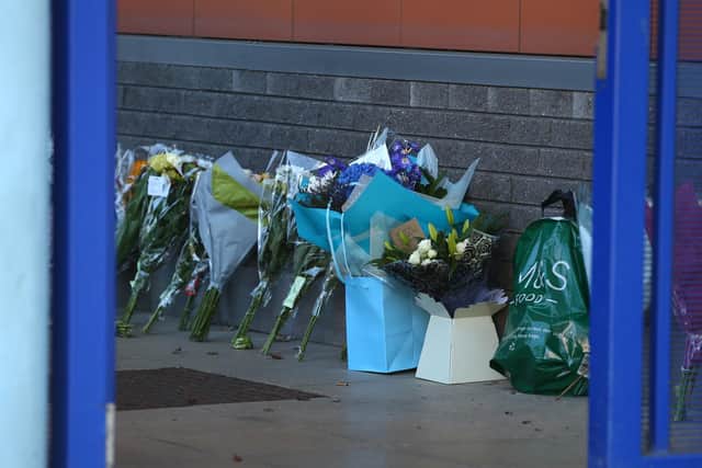 Flowers left outside of Croydon Police Station in tribute to Matt Ratana