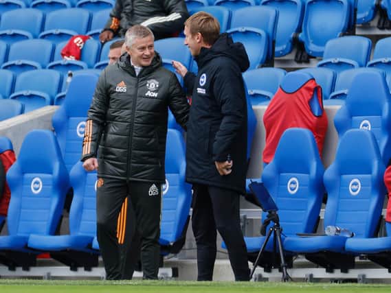 Ole Gunnar Solskjaer, Manager of Manchester United greets Graham Potter, Head Coach of Brighton and Hove Albion prior to the Premier League match between Brighton & Hove Albion and Manchester United (Photo by John Sibley - Pool/Getty Images)