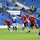 Neal Maupay dinks home his penalty in the first half against Manchester United