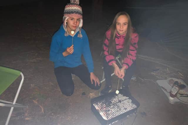 Ellie Aungier and Bronwyn Marshall camped out in the woods in hammocks to raise money for Crisis