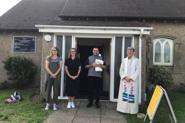 The Rev Jane Bartlett with the Archdeacon Martin Lloyd Williams and church wardens Emma Purser and Lucy Walmsley