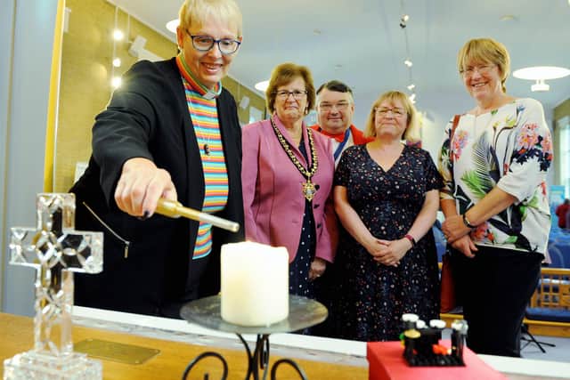 Launching last year's Worthing Mental Health Awareness Week, 
DDawn Carn, minister of Offington Park Methodist Church lights the candle, with Hazel Thorpe, Bob Smytherman, Carol Barber and Val Turner. Picture: Kate Shemilt ks190553-1