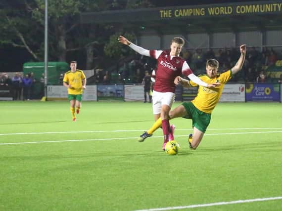 Penalty? No but Dom Di Paola felt this challenge on Rob O'Toole should have given Horsham a spot kick / Picture: John Lines