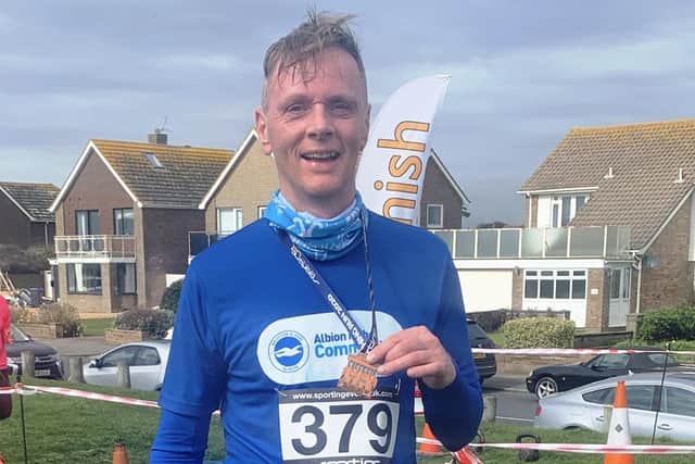 Ian Schiffer with his medal after completing the West Worthing 10k in March