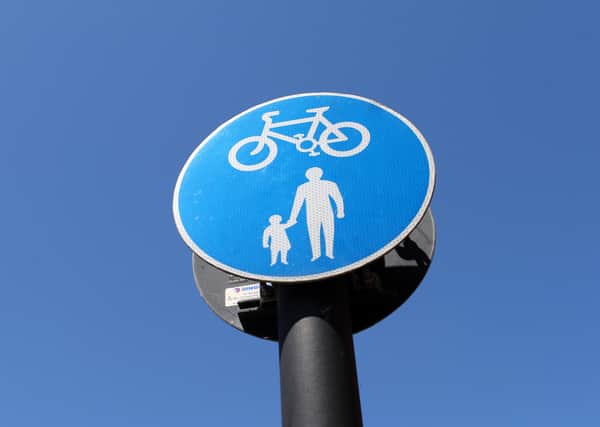 A pedestrian and cyclist sign  (Photo by Catherine Ivill/Getty Images)