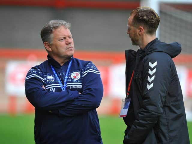 Crawley Town boss John Yems talks to Southend United boss Mark Molesley before the game