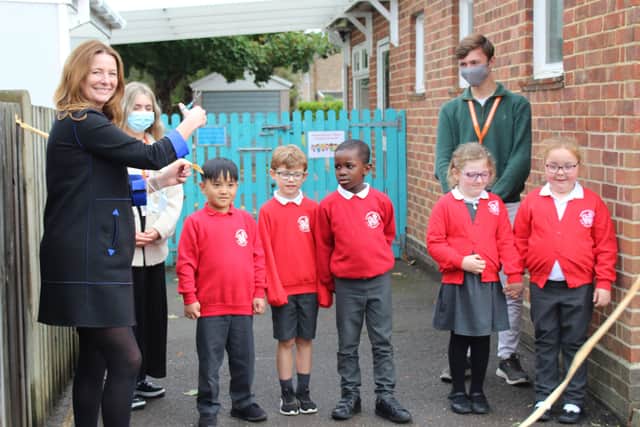 Chichester MP Gillian Keegan at the opening of The Bishop Luffa Learning Partnership at Rumboldswhyke CE Infants’ School, with year two pupils and Bishop Luffa School captains Ethan Storey and Freya Jones