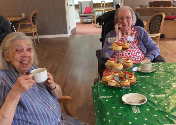 Residents at Red Oaks care home in Henfield enjoying the virtual coffee morning held for Macmillan Cancer Support SUS-200610-084335001