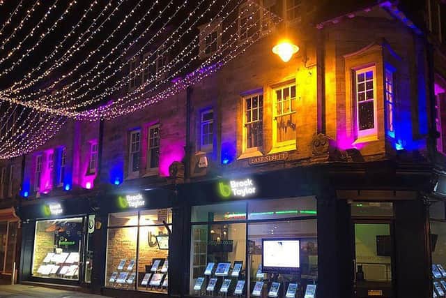 Horsham estate agents Brock Taylor has changed its lights to blue and pink to support Horsham parents Helen and Chris Kowalkowski during Baby Loss Awareness Week 2020 SUS-201210-112602001