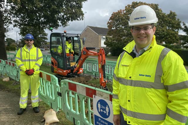 Mid Sussex District Council leader Jonathan Ash-Edwards (right) with contractors