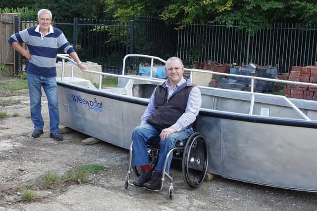 Wey & Arun Canal Trust director, John Reynolds, and Wheelyboat Trust director, Andy Beadsley SUS-201210-153255001
