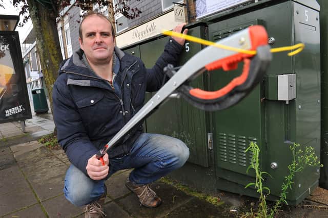 Ben Dolley is annoyed at BT leaving off cuts of wires around junction boxes in Horsham. Pic Steve Robards SR2010124 SUS-201210-184815001