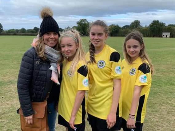 Under-14s players Issy Connor, Grace Hill and Nicole Cossey with skin:genius founder Julia Vearncombe.