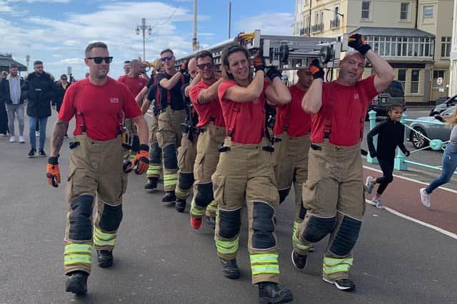 David Mayfield with firefighters walking from Shoreham Fire Station to Brighton Palace Pier