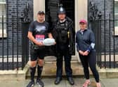 Simon Stevens with Mel Gilmour and an on-duty officer