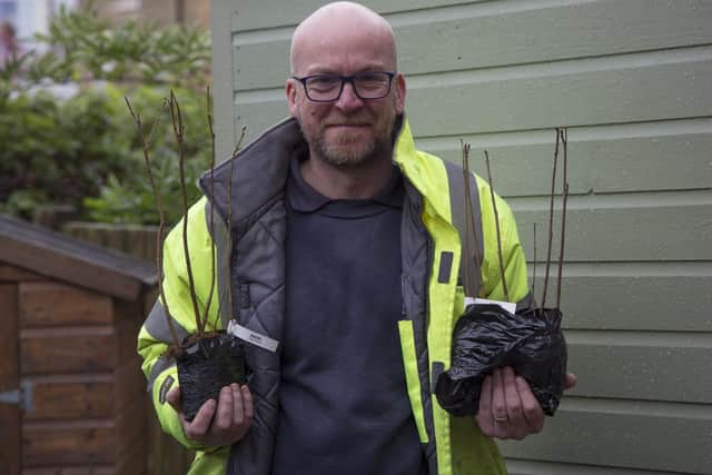 Anthony Read, community park ranger at Worthing Borough Council, with the donated hazel and rowan trees. Picture:  Julia Horbaschk