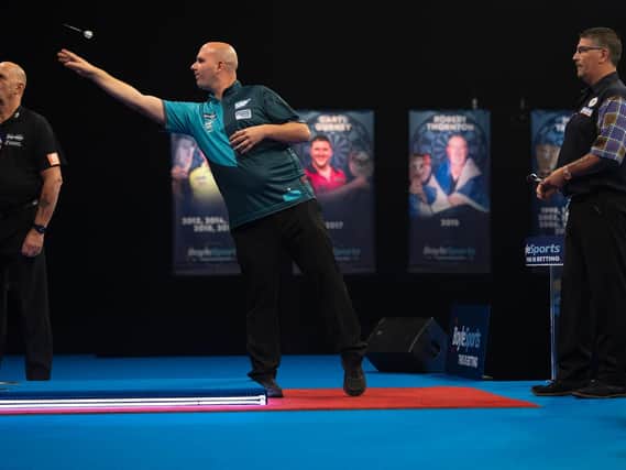 Rob Cross in recent World Grand Prix action / Picture by Lawrence Lustig, PDC