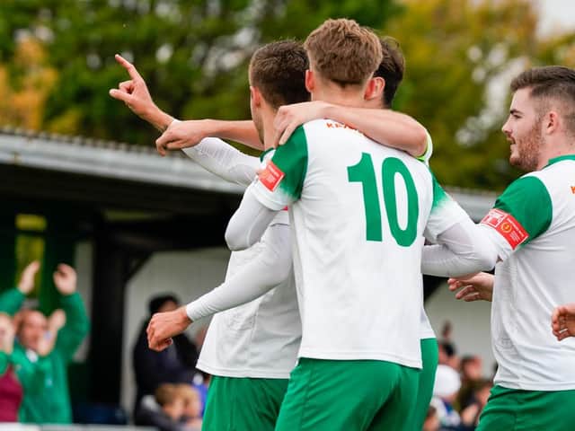 Bognor players celebrate with Ashton Leigh, who downed East Thurrock with a hat-trick / Picture: Lyn Phillips