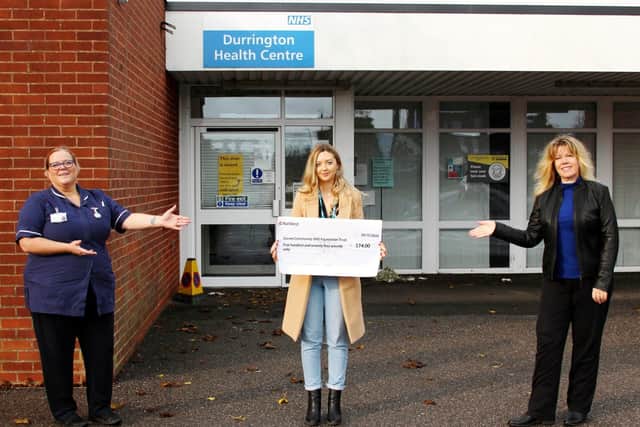 Tracey O’Reilly and Melissa White from female duo HALO present a cheque for £574 to Rosie Hemming, community fundraising manager for Sussex Community NHS Foundation Trust, at Durrington Health Centre