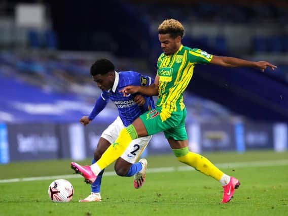Brighton's Tariq Lamptey battles for possession with Grady Diangana of West Bromwich Albion