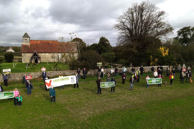 More than 50 residents of Arundel and the local villages of Tortington, Binsted and Walberton gathered at safe distances by St Mary’s, the 12th century church at Binsted, to protest against the latest announcement by Highways England of ‘grey’ as their preferred route for the Arundel Bypass.